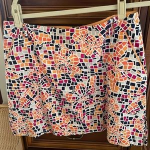 Golf skort, can be worn as a skirt.  Belt loops 17 1/2” length,  34” waist